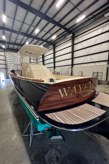 Wayfarer Yacht Photos Pics 2002 Hinckley Talaria 29C boat in storage, featuring elegant wood detailing.