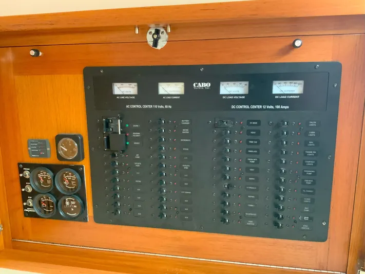 Arbutus Yacht Photos Pics Electrical control panel of 2006 Cabo 32 Express HT boat, featuring gauges and switches.