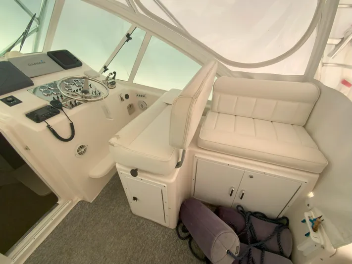 Arbutus Yacht Photos Pics 2006 Cabo 32 Express HT helm with seating and control panel.