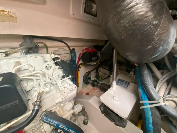 Arbutus Yacht Photos Pics Engine room of 2006 Cabo 32 Express HT boat, showcasing mechanical components and wiring.