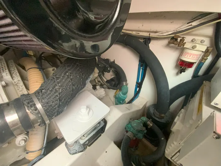 Arbutus Yacht Photos Pics Engine compartment of a 2006 Cabo 32 Express HT boat, showing hoses and components.