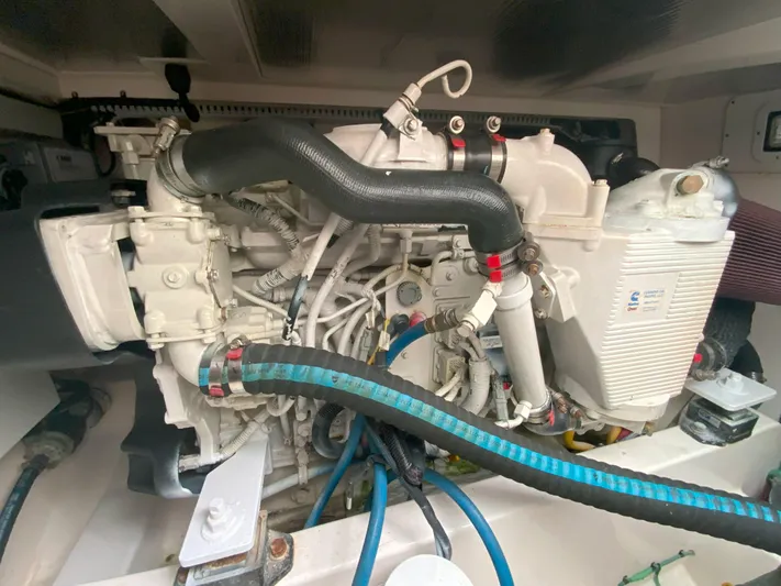 Arbutus Yacht Photos Pics Engine compartment of a 2006 Cabo 32 Express HT boat, showcasing detailed mechanical components.