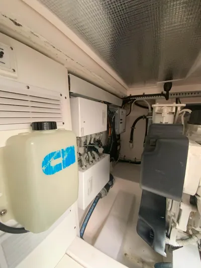 Arbutus Yacht Photos Pics Engine room of 2006 Cabo 32 Express HT boat, showcasing mechanical components.