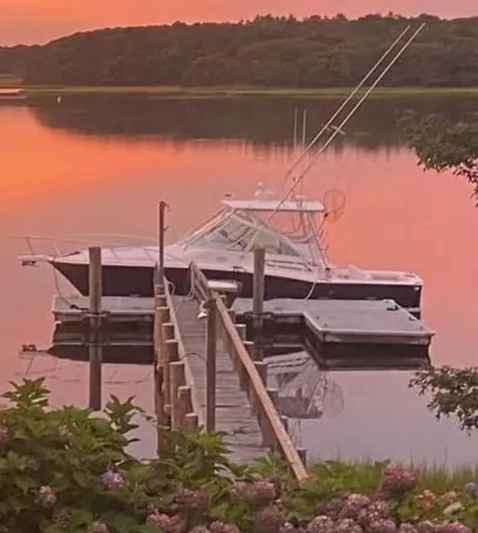 Arbutus Yacht Photos Pics 2006 Cabo 32 Express HT docked at sunset, serene lake view.
