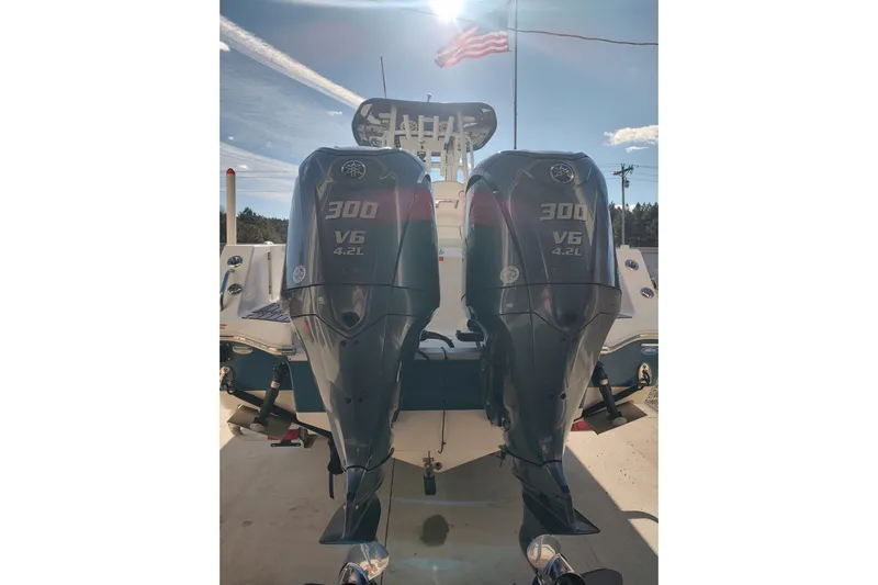  Yacht Photos Pics 2023 Tidewater 292 CC Adventure with dual 300 V6 4.2L engines, American flag in background.