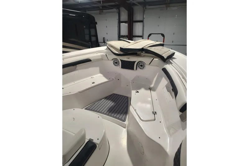  Yacht Photos Pics 2023 Tidewater 292 CC Adventure boat interior with seating and storage compartments.