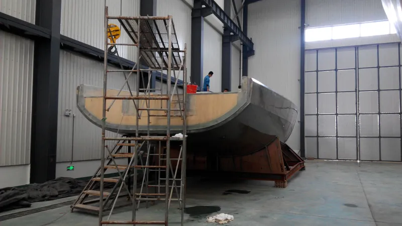  Yacht Photos Pics 2026 Mazarin 72 Cruiser/Racer Gen II under construction in a spacious indoor facility.