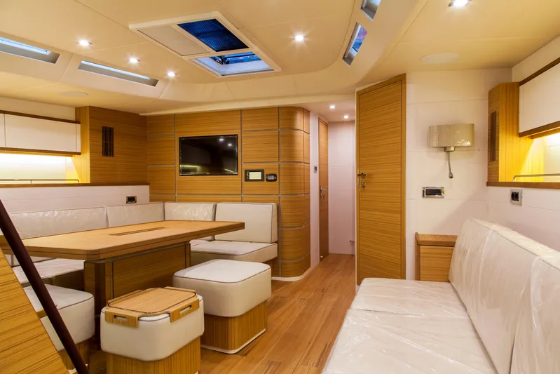  Yacht Photos Pics Luxurious interior of 2026 Mazarin 72 Cruiser/Racer yacht with modern wood finish and seating.
