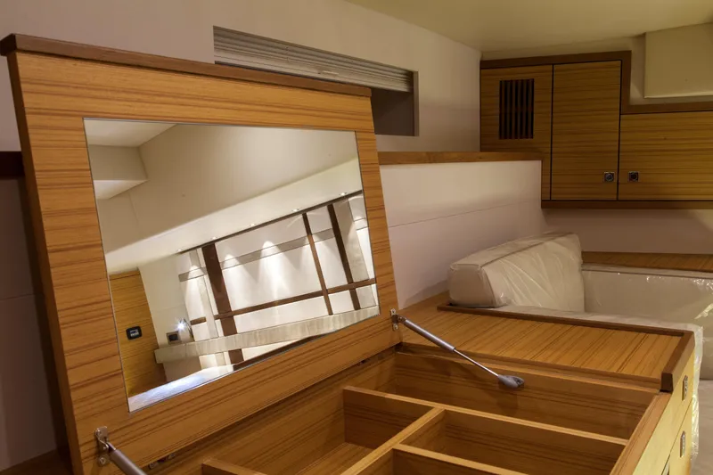  Yacht Photos Pics Interior of 2026 Mazarin 72 Cruiser/Racer, featuring elegant wood finish and built-in mirror.