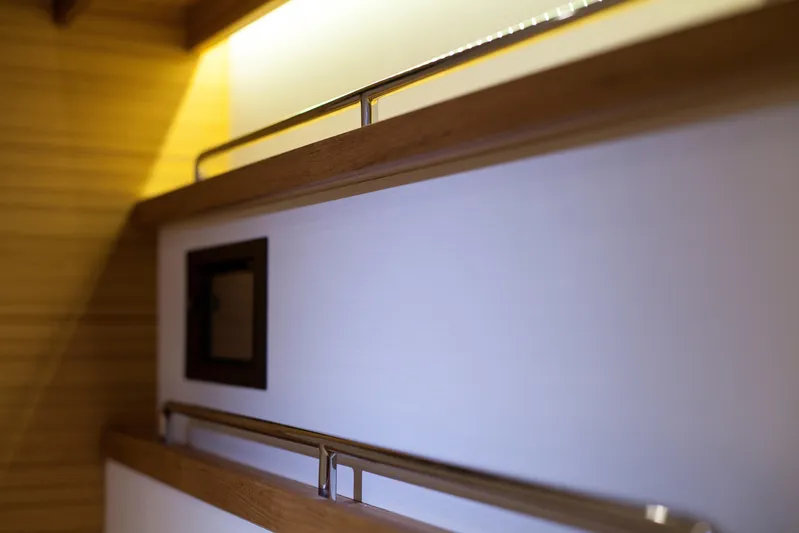  Yacht Photos Pics Interior detail of 2026 Mazarin 72 Cruiser/Racer Gen II yacht, featuring sleek wood and metal design.