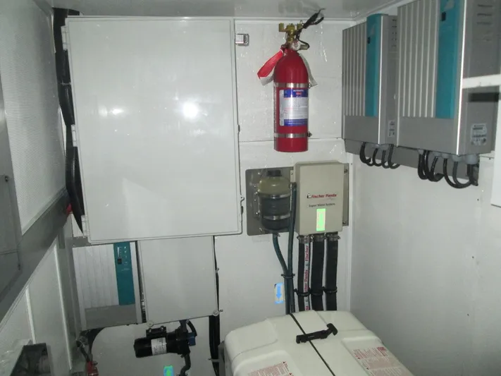  Yacht Photos Pics Electrical control room of 2026 Mazarin 72 Cruiser/Racer Gen II with fire extinguisher and equipment.