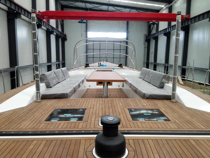  Yacht Photos Pics Mazarin 72 Cruiser/Racer Gen II 2026 yacht interior with wooden deck and seating area.