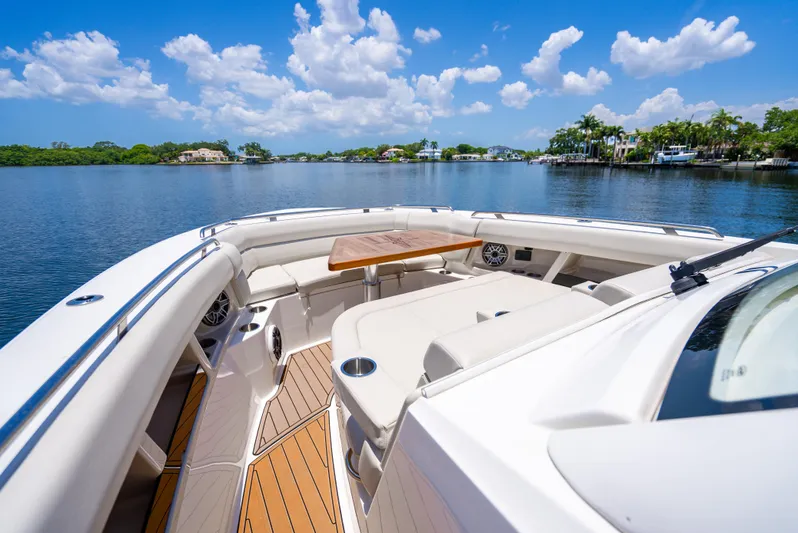  Yacht Photos Pics 2021 Boston Whaler 350 Realm boat with spacious deck and scenic water view.