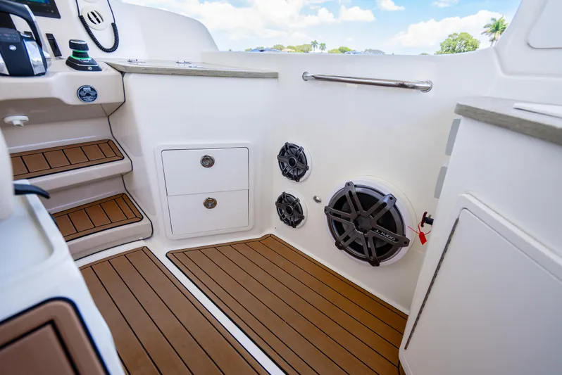  Yacht Photos Pics Interior of 2021 Boston Whaler 350 Realm, featuring wood flooring and built-in speakers.