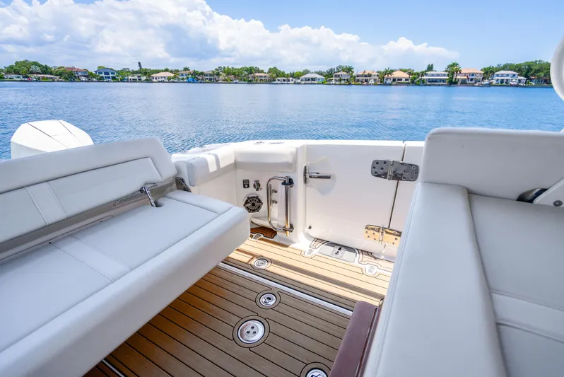  Yacht Photos Pics Boston Whaler 350 Realm 2021 boat interior with seating and scenic water view.