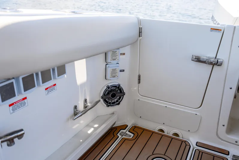  Yacht Photos Pics Interior view of 2021 Boston Whaler 350 Realm boat, featuring sleek design and wood flooring.
