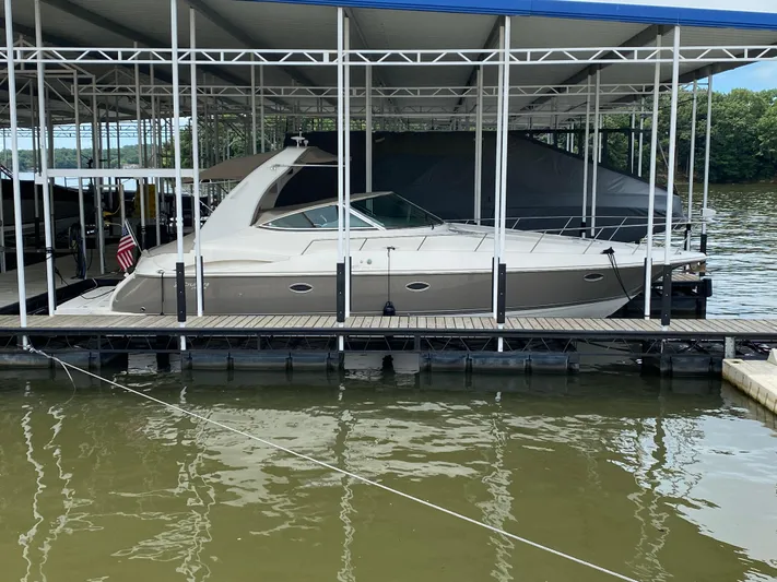  Yacht Photos Pics 2007 Cruisers Yachts 370 Express docked under covered marina.