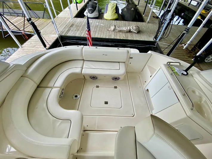  Yacht Photos Pics 2007 Cruisers Yachts 370 Express interior with seating and dock view.