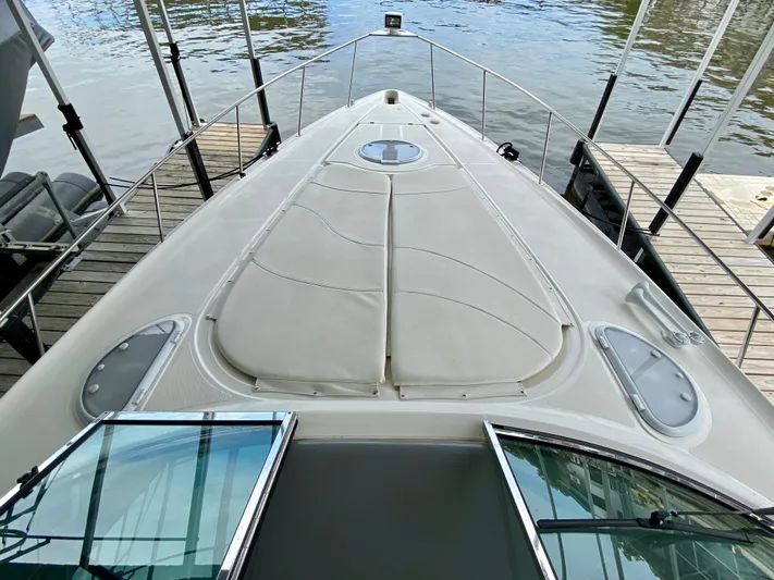  Yacht Photos Pics 2007 Cruisers Yachts 370 Express boat docked, showcasing spacious deck and sleek design.