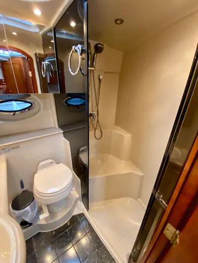  Yacht Photos Pics Luxurious bathroom in 2007 Cruisers Yachts 370 Express, featuring shower and toilet.