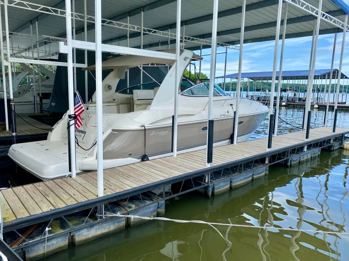  Yacht Photos Pics 2007 Cruisers Yachts 370 Express docked under covered marina.