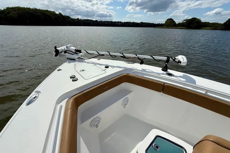  Yacht Photos Pics 2021 Sea Hunt Gamefish 27 Coffin Box boat on a serene lake with clear skies.