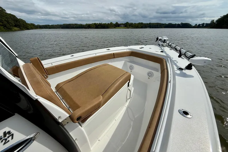  Yacht Photos Pics 2021 Sea Hunt Gamefish 27 Coffin Box boat on a serene lake.
