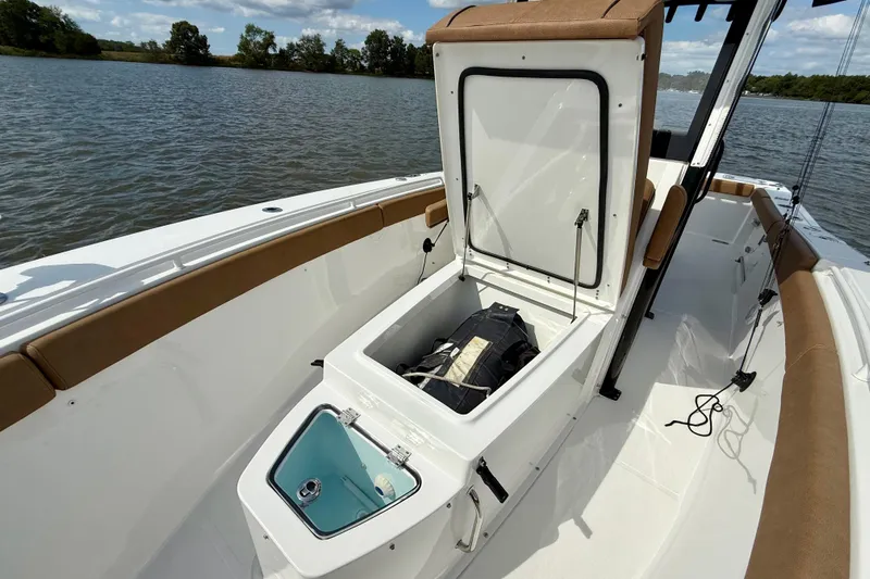  Yacht Photos Pics 2021 Sea Hunt Gamefish 27 Coffin Box with open storage on a calm lake.