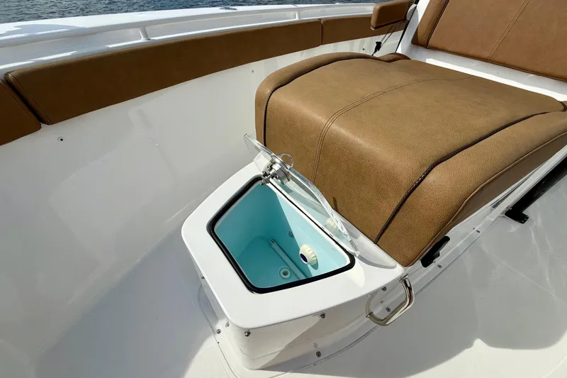  Yacht Photos Pics 2021 Sea Hunt Gamefish 27 Coffin Box with open storage compartment and cushioned seating.