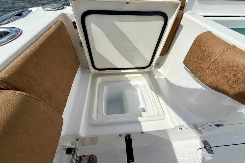  Yacht Photos Pics 2021 Sea Hunt Gamefish 27 Coffin Box interior with open storage compartment and cushioned seating.