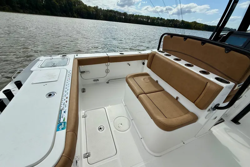  Yacht Photos Pics 2021 Sea Hunt Gamefish 27 Coffin Box boat interior with tan seating and rod holders.
