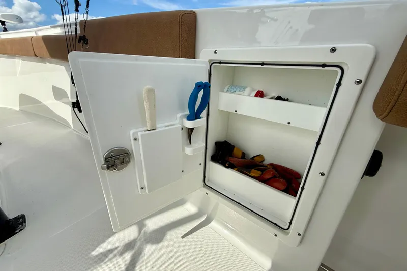  Yacht Photos Pics 2021 Sea Hunt Gamefish 27 Coffin Box storage compartment with tools and accessories.