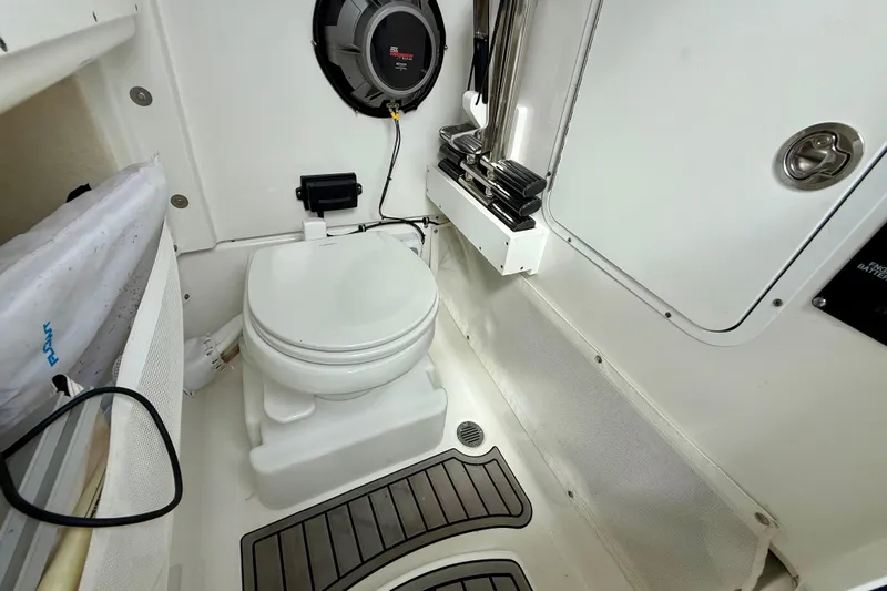  Yacht Photos Pics 2021 Sea Hunt Gamefish 27 Coffin Box boat interior with toilet and speaker system.