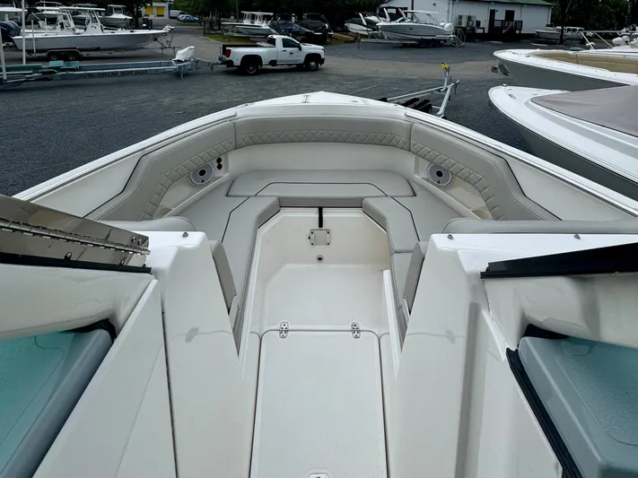  Yacht Photos Pics 2024 Pursuit DC 295 Dual Console boat interior with spacious seating and sleek design.
