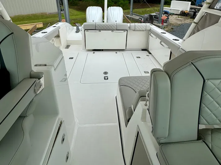  Yacht Photos Pics 2024 Pursuit DC 295 Dual Console boat interior with spacious seating and modern design.