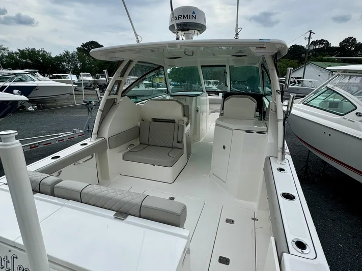  Yacht Photos Pics 2024 Pursuit DC 295 Dual Console boat with spacious seating and modern design.
