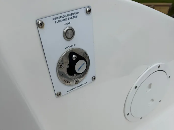  Yacht Photos Pics Reverso Outboard Flushing System on 2024 Pursuit DC 295 Dual Console boat.