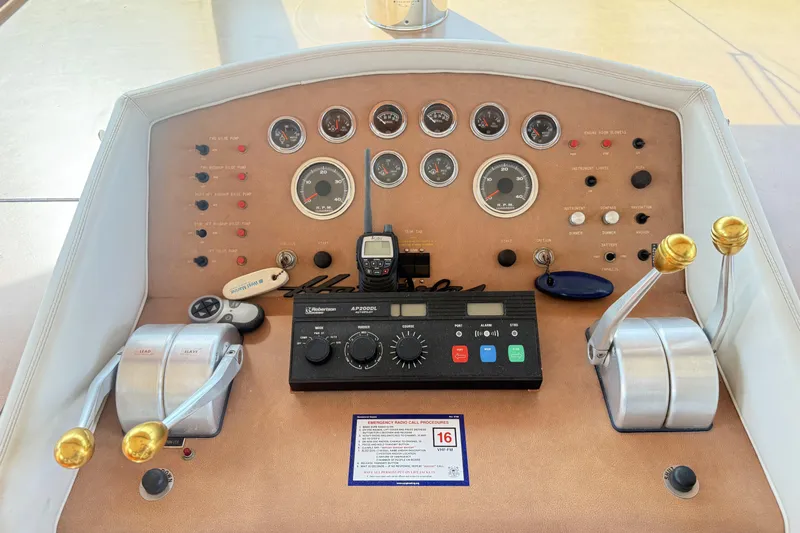 Lady Malan Yacht Photos Pics Control panel of a 1987 Hatteras 54 Motor Yacht with gauges and levers.