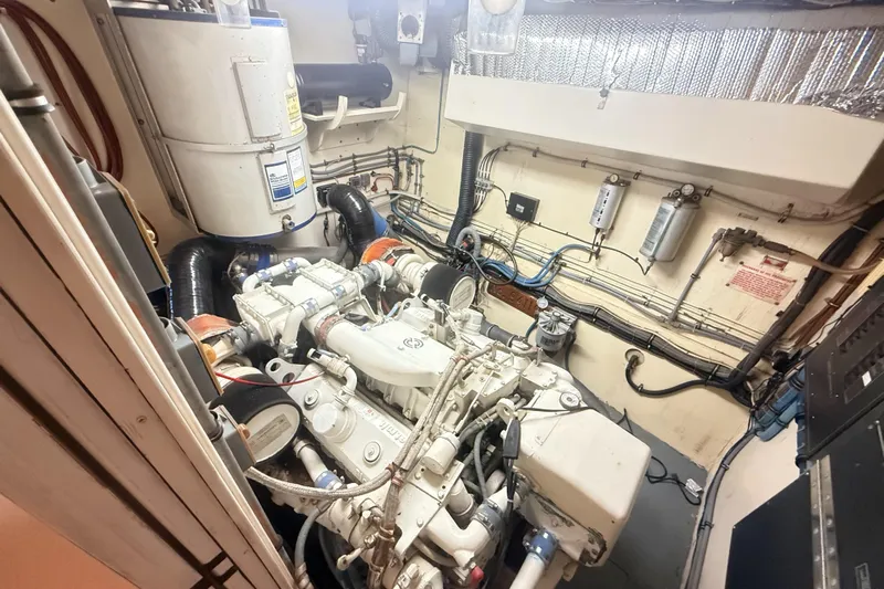 Lady Malan Yacht Photos Pics Engine room of 1987 Hatteras 54 Motor Yacht, showcasing mechanical components and wiring.