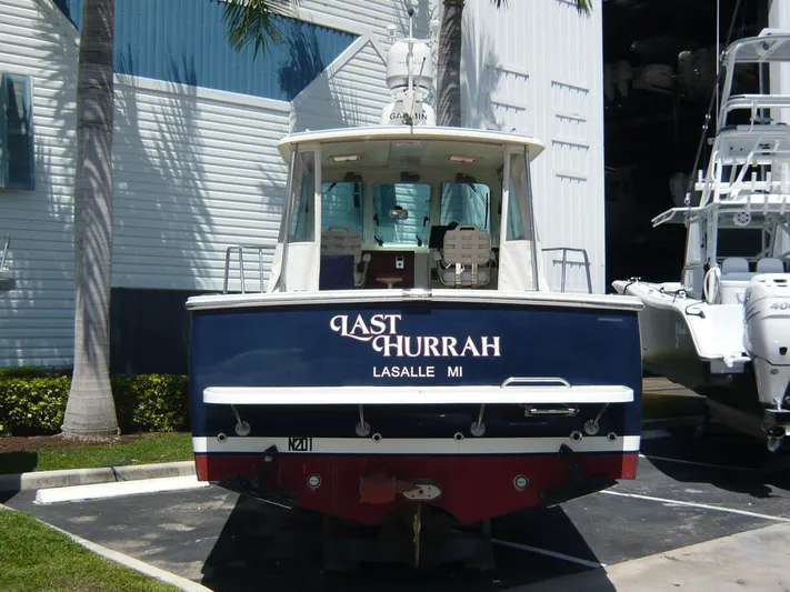 Last Hurrah Yacht Photos Pics 2008 Back Cove 29 boat named "Last Hurrah" docked in a marina.