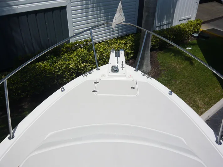 Last Hurrah Yacht Photos Pics Bow of 2008 Back Cove 29 boat, featuring sleek design and stainless steel railings.