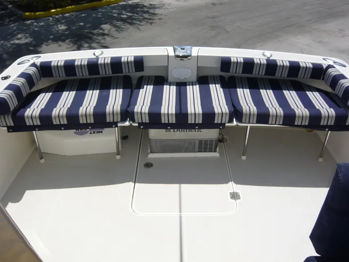 Last Hurrah Yacht Photos Pics 2008 Back Cove 29 boat with striped seating on deck.
