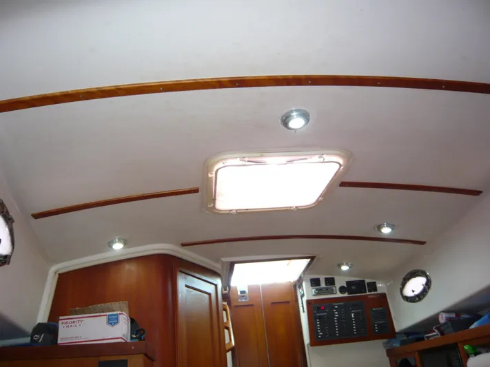 Last Hurrah Yacht Photos Pics 2008 Back Cove 29 cabin interior with wood accents and ceiling lights.