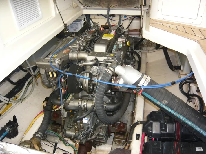 Last Hurrah Yacht Photos Pics Engine compartment of a 2008 Back Cove 29 boat, showcasing detailed mechanical components.