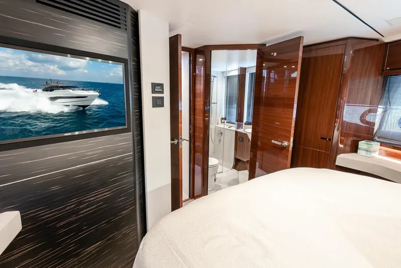 Fly By Yacht Photos Pics Luxurious interior of 2019 Princess V65 yacht with modern design and elegant wood finishes.