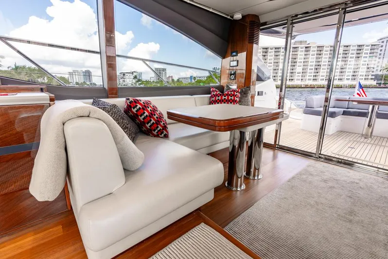 Fly By Yacht Photos Pics Luxurious interior of 2019 Princess V65 yacht with elegant seating and modern decor.
