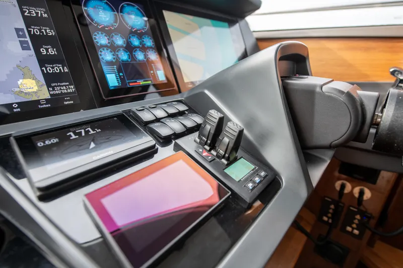 Fly By Yacht Photos Pics Control panel of 2019 Princess V65 yacht with advanced navigation displays.