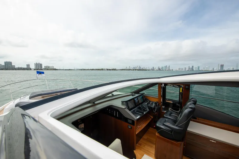 Fly By Yacht Photos Pics 2019 Princess V65 yacht interior with city skyline in the background.