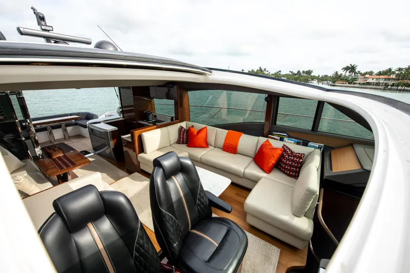 Fly By Yacht Photos Pics Luxurious 2019 Princess V65 yacht interior with leather seats and plush cushions.