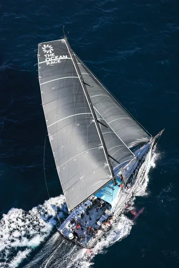  Yacht Photos Pics Aerial view of 2014 Farr Volvo Ocean 65 sailboat racing in open sea.